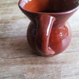 Small two-tone brown-yellow terracotta pitcher