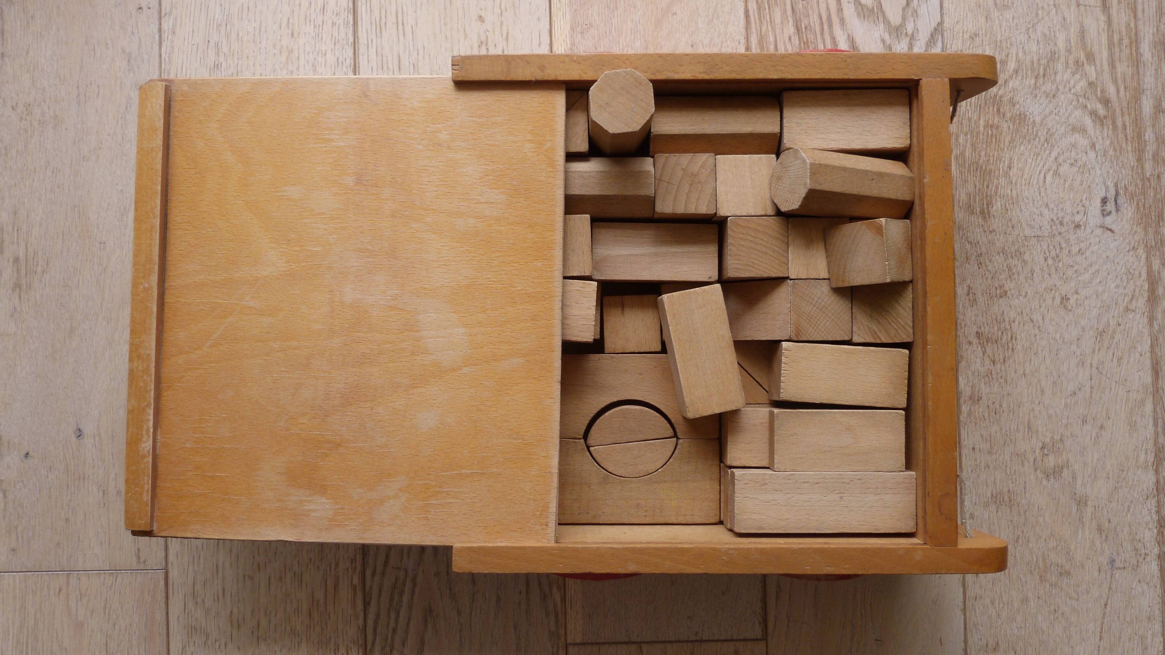 Old raw wood construction game in its cart