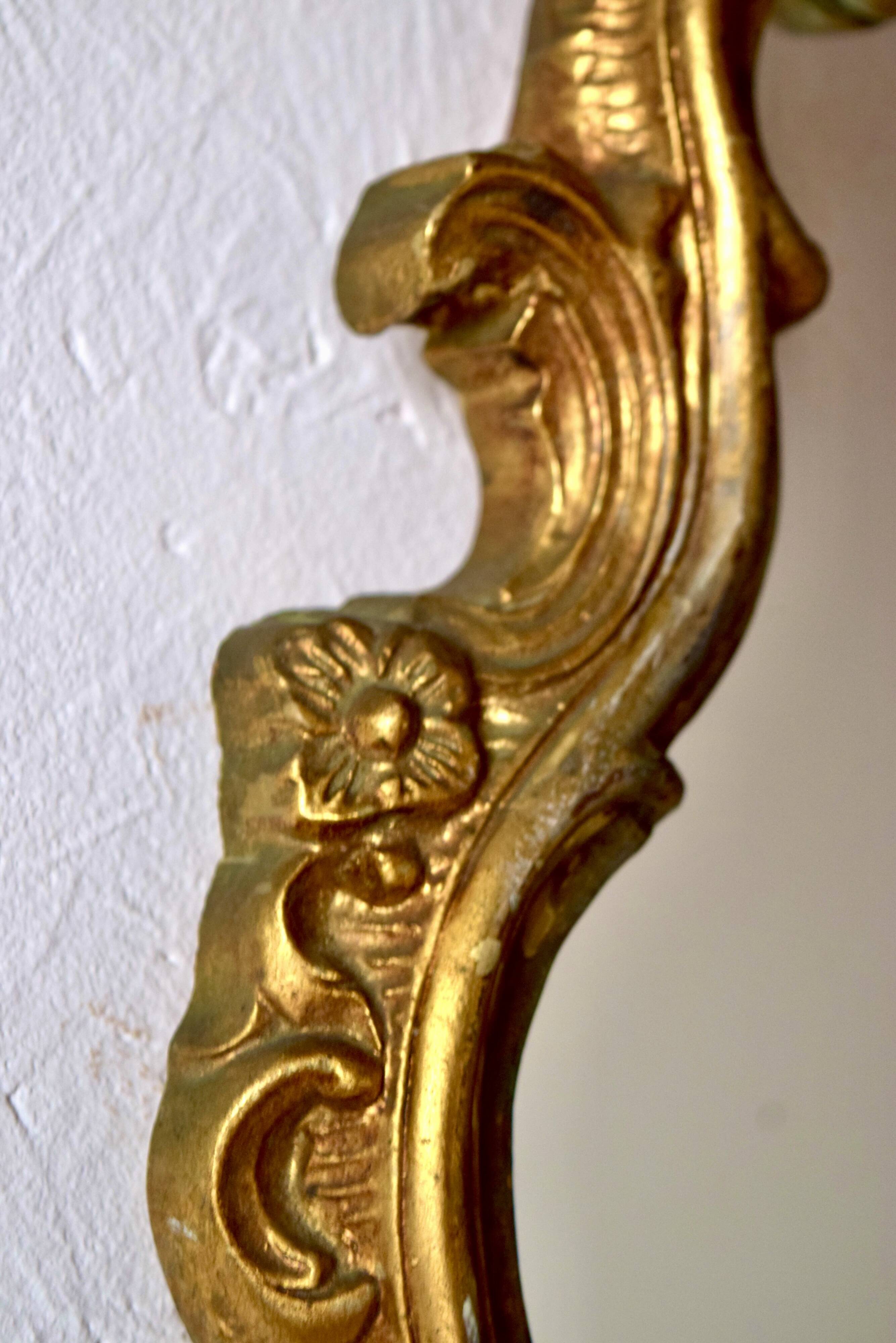 Large rococo mirror in gold painted wood