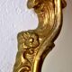 Large rococo mirror in gold painted wood