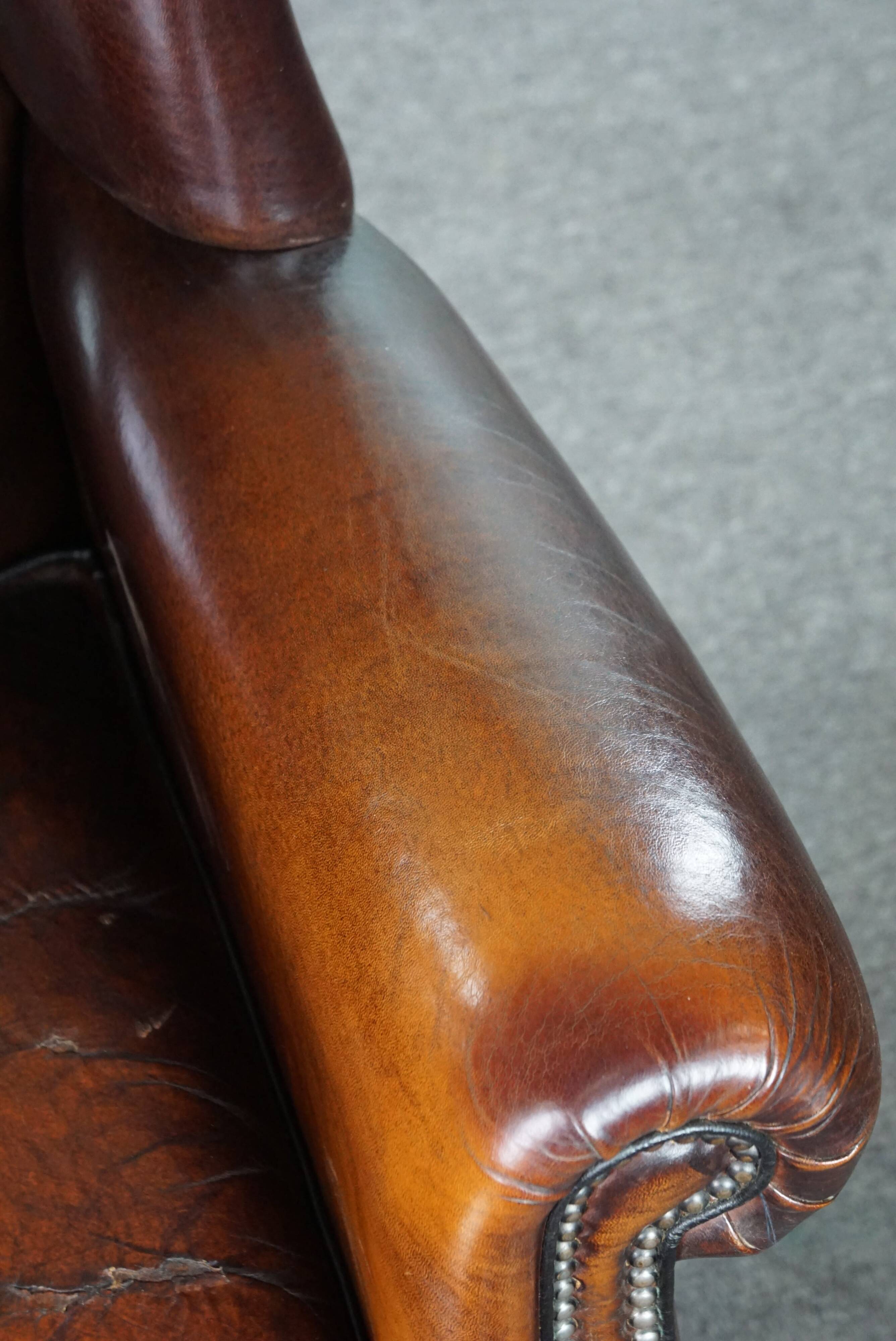 Luxurious large sheep leather wingback armchair with beautiful colors and amazing patina
