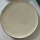 Set of 6 cream and grey-blue glazed earthenware plates.