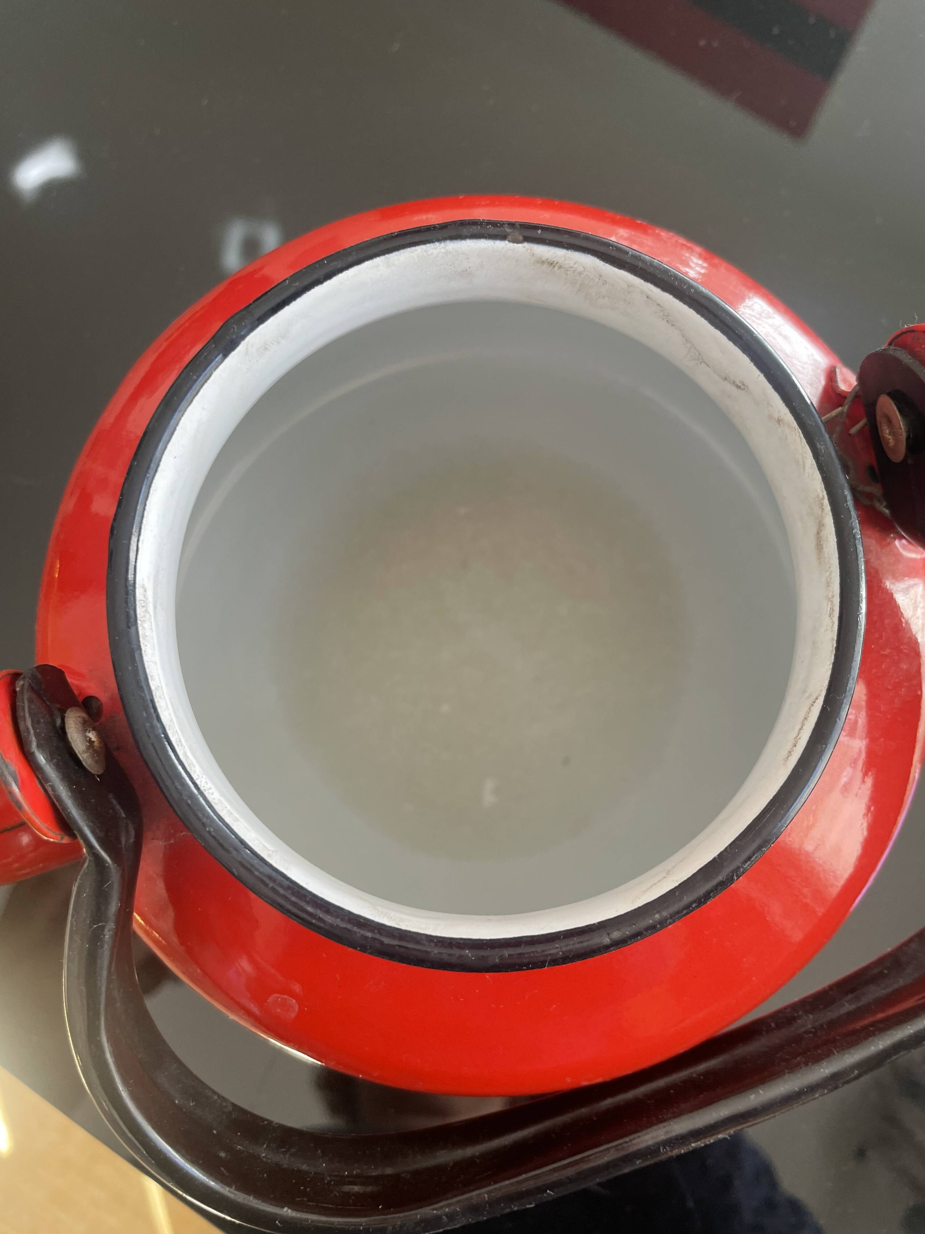 Red enamelled sheet metal kettle