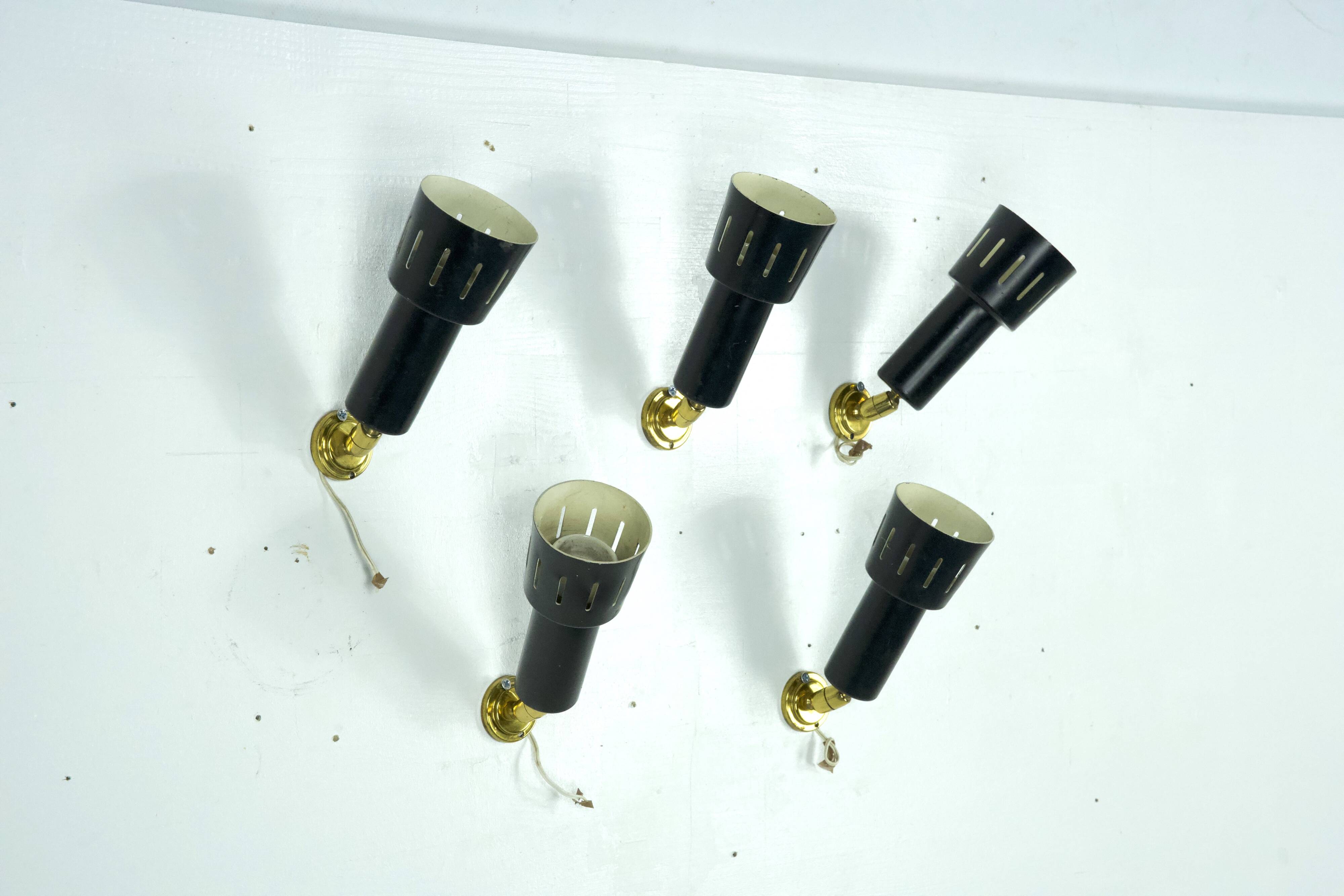 Set of five Stilnovo style spotlights in brass and lacquered metal. Italy