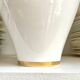 White and gold porcelain vase with black patterns by Mauricio Ortiz