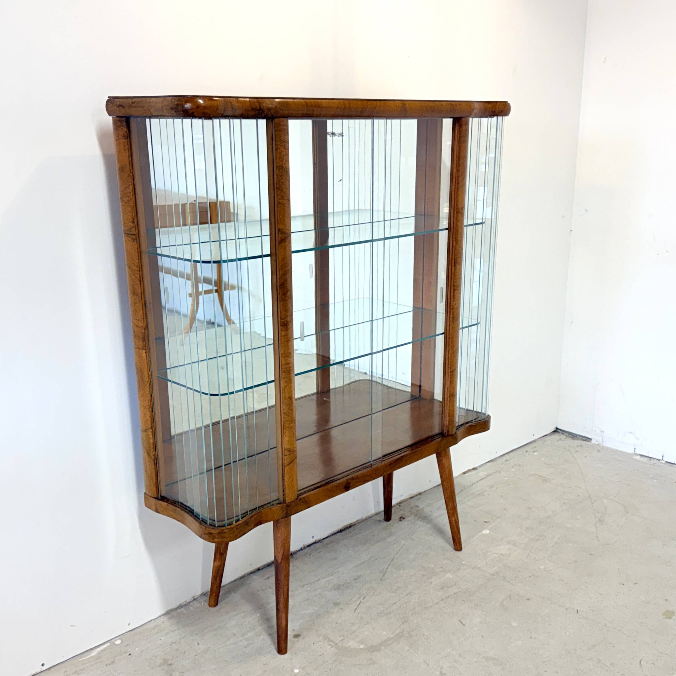 Elegant, curved display cabinet in Art Deco style