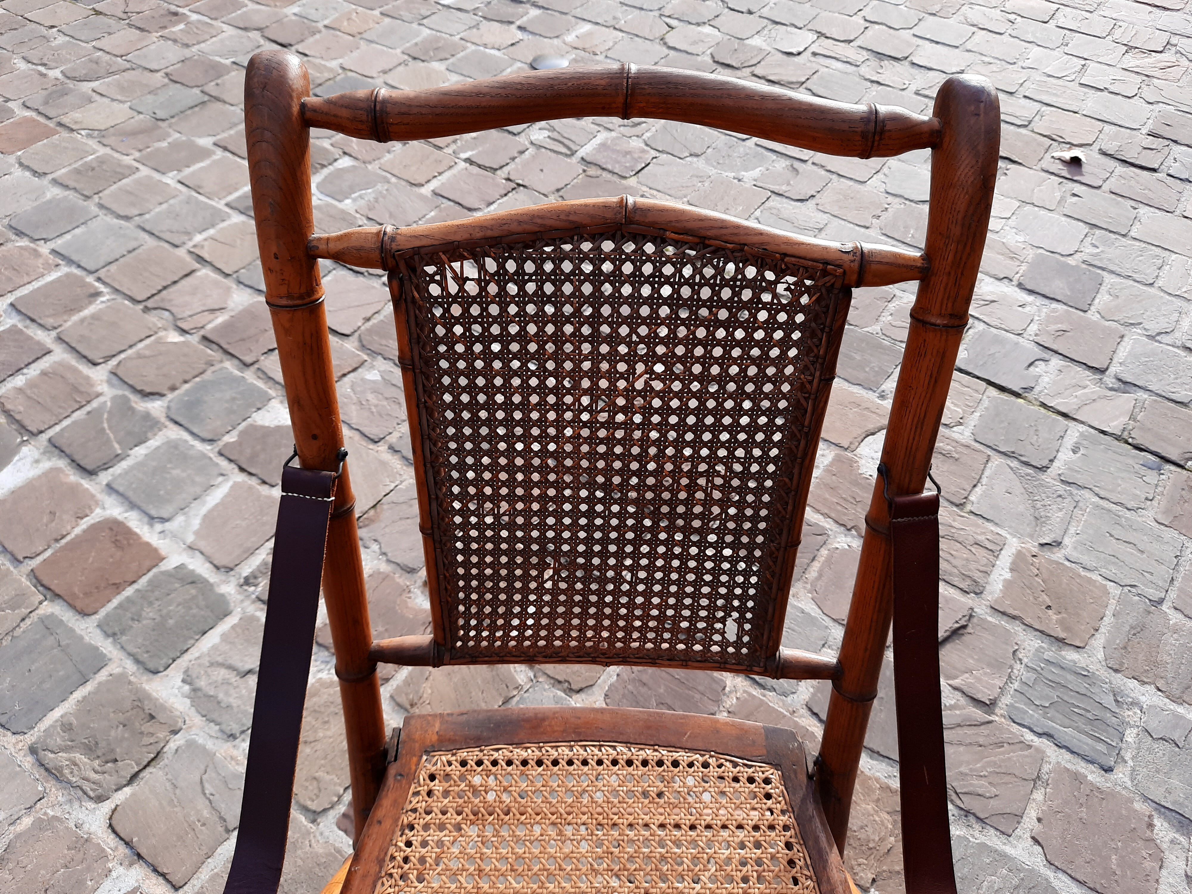 Bamboo folding chair and caning, leather and brass