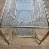 Rare bronze, brass, and steel mesh coffee table with a double glass top resting on a brass mesh. French work by Jansen