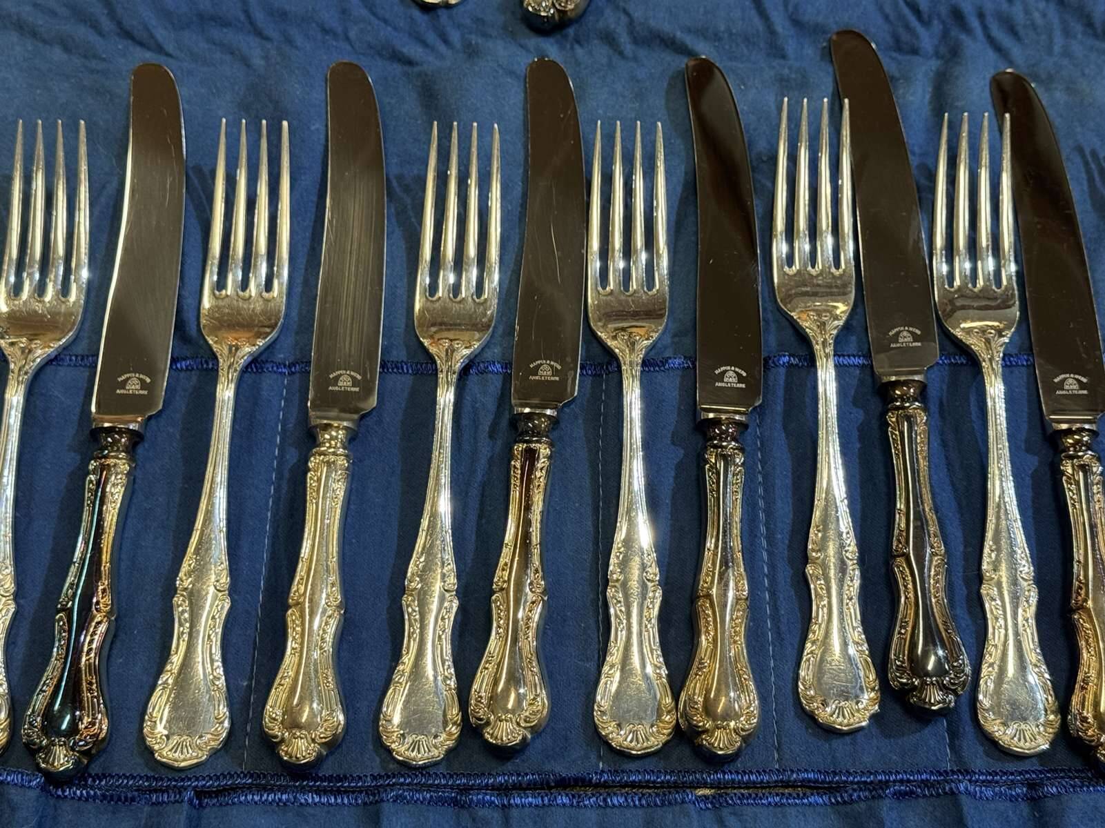 Set of 12 knives and 12 forks by Mappin and Webb in silver-plated metal.