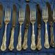 Set of 12 knives and 12 forks by Mappin and Webb in silver-plated metal.