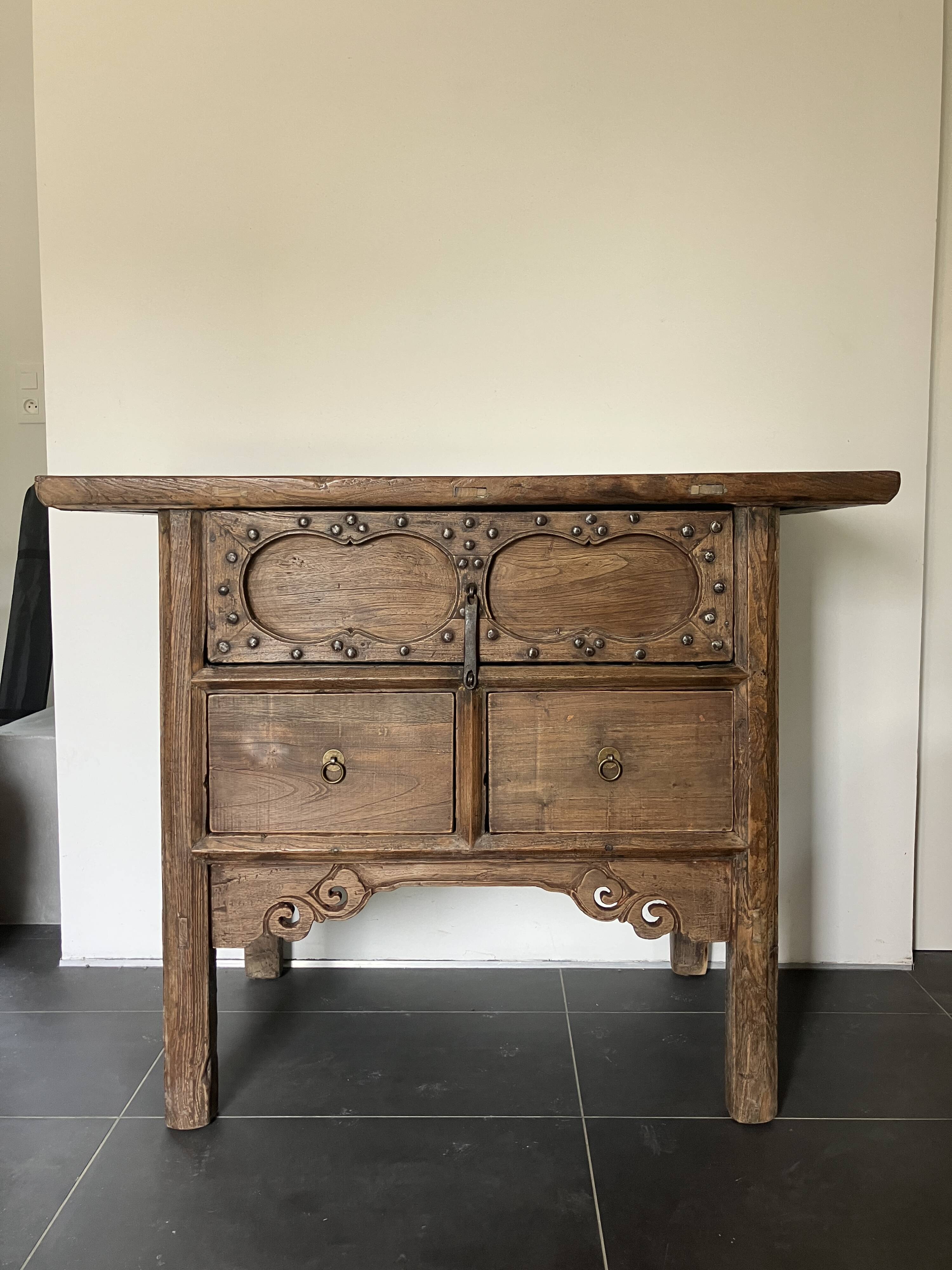 Very old elm wood with carved patterns and ironwork pieces.