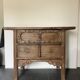 Very old elm wood with carved patterns and ironwork pieces.
