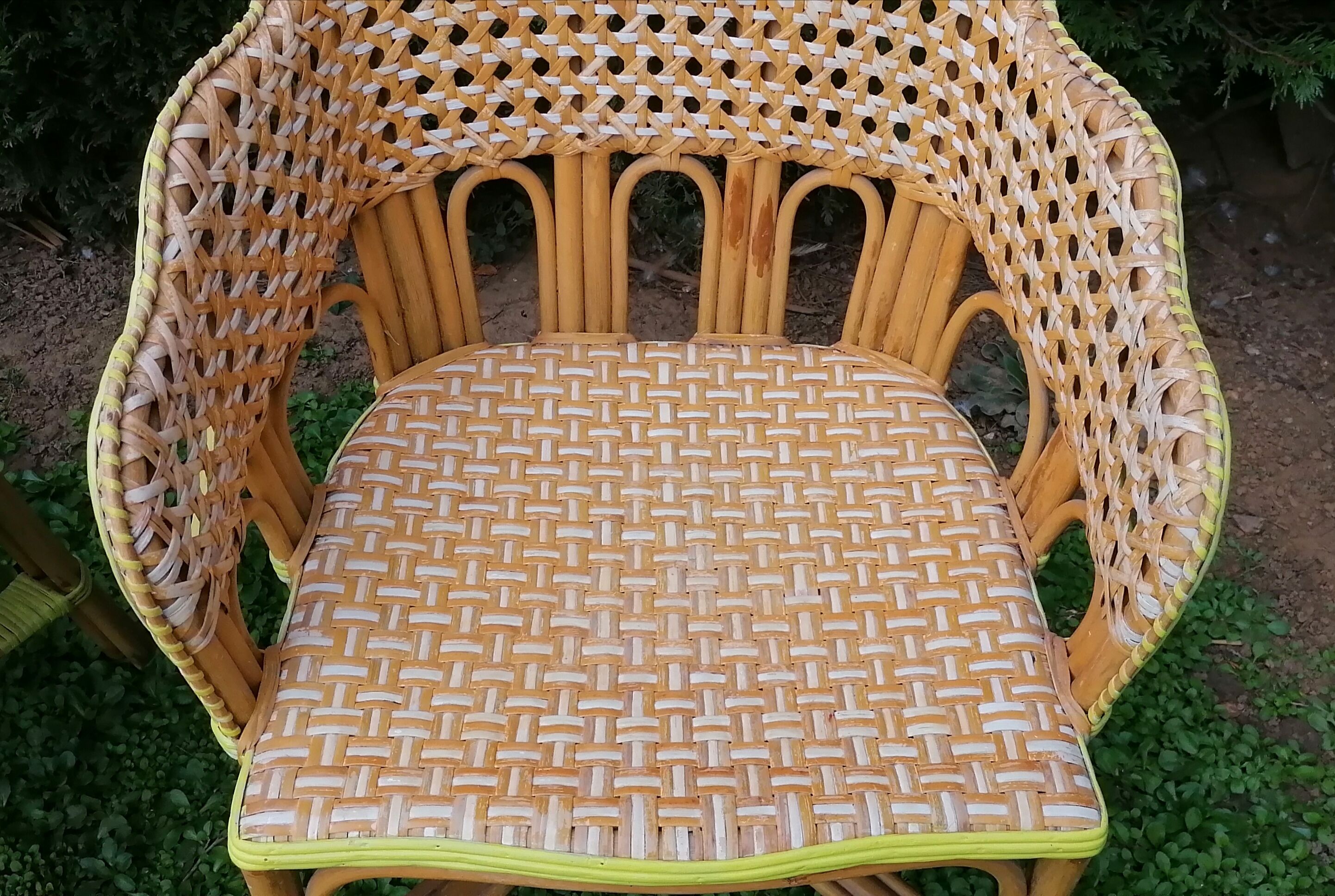 3 woven rattan armchairs