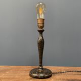 Black table lamp with paint splatters from the 1920s