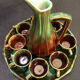 Large service in green and brown glazed stoneware with facets, signed Louis Cag.