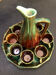 Large service in green and brown glazed stoneware with facets, signed Louis Cag.