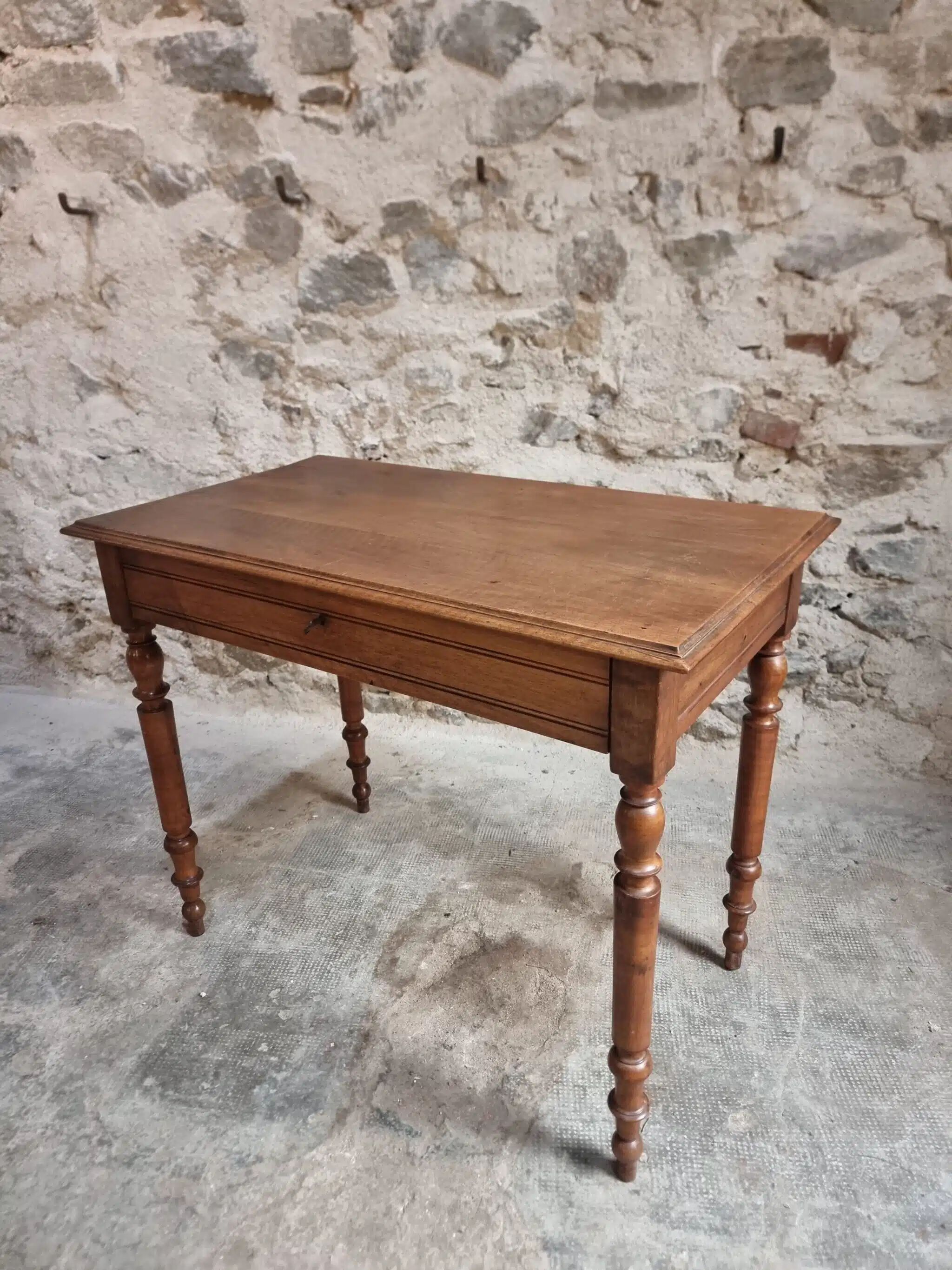 Antique French writing table in walnut with a drawer, circa 1900.