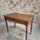 Antique French writing table in walnut with a drawer, circa 1900.