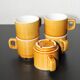 Set of 5 vintage mustard-coloured ceramic mugs.