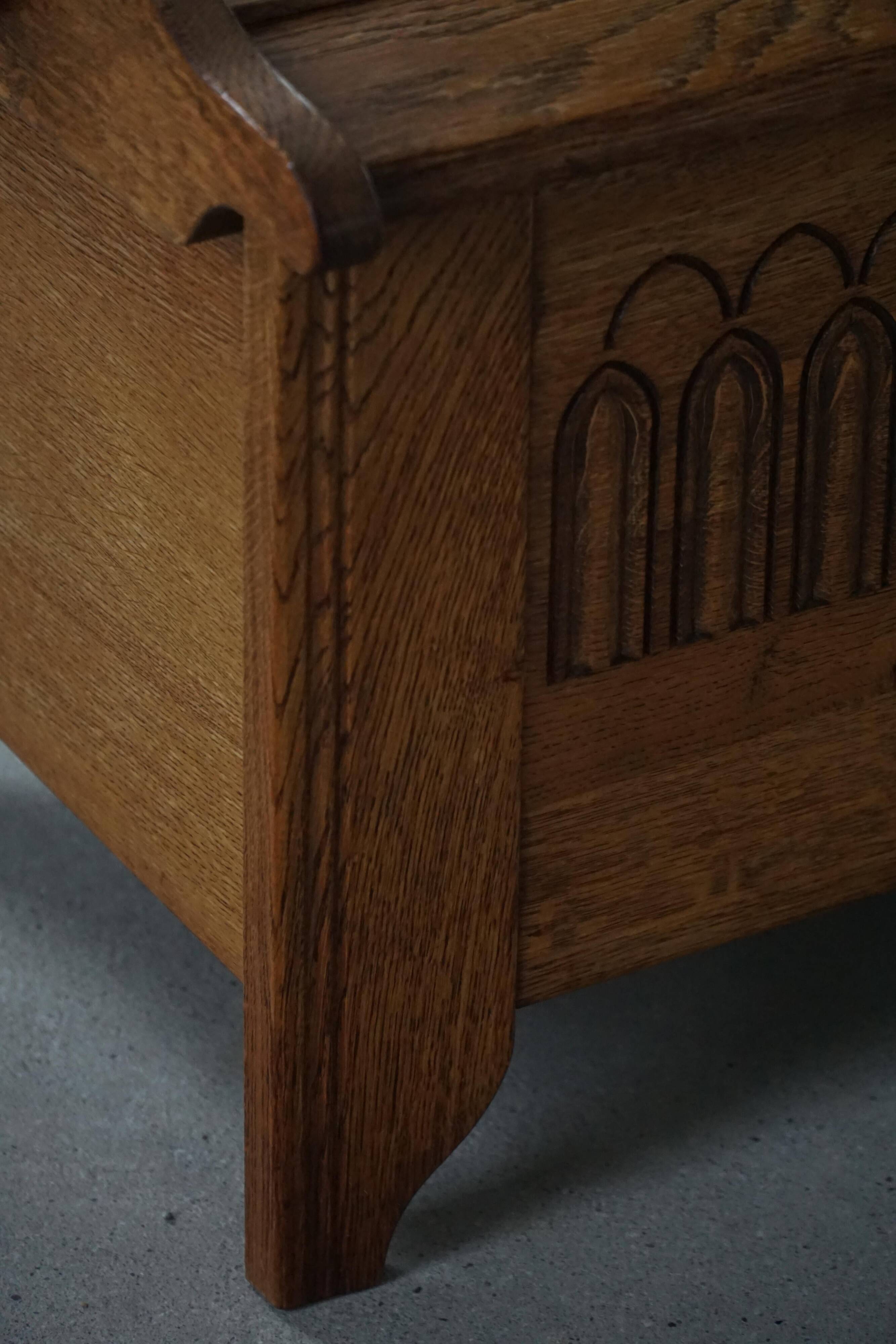 Modern Danish oak commode with decorative relief sculpture, mid-20th century.