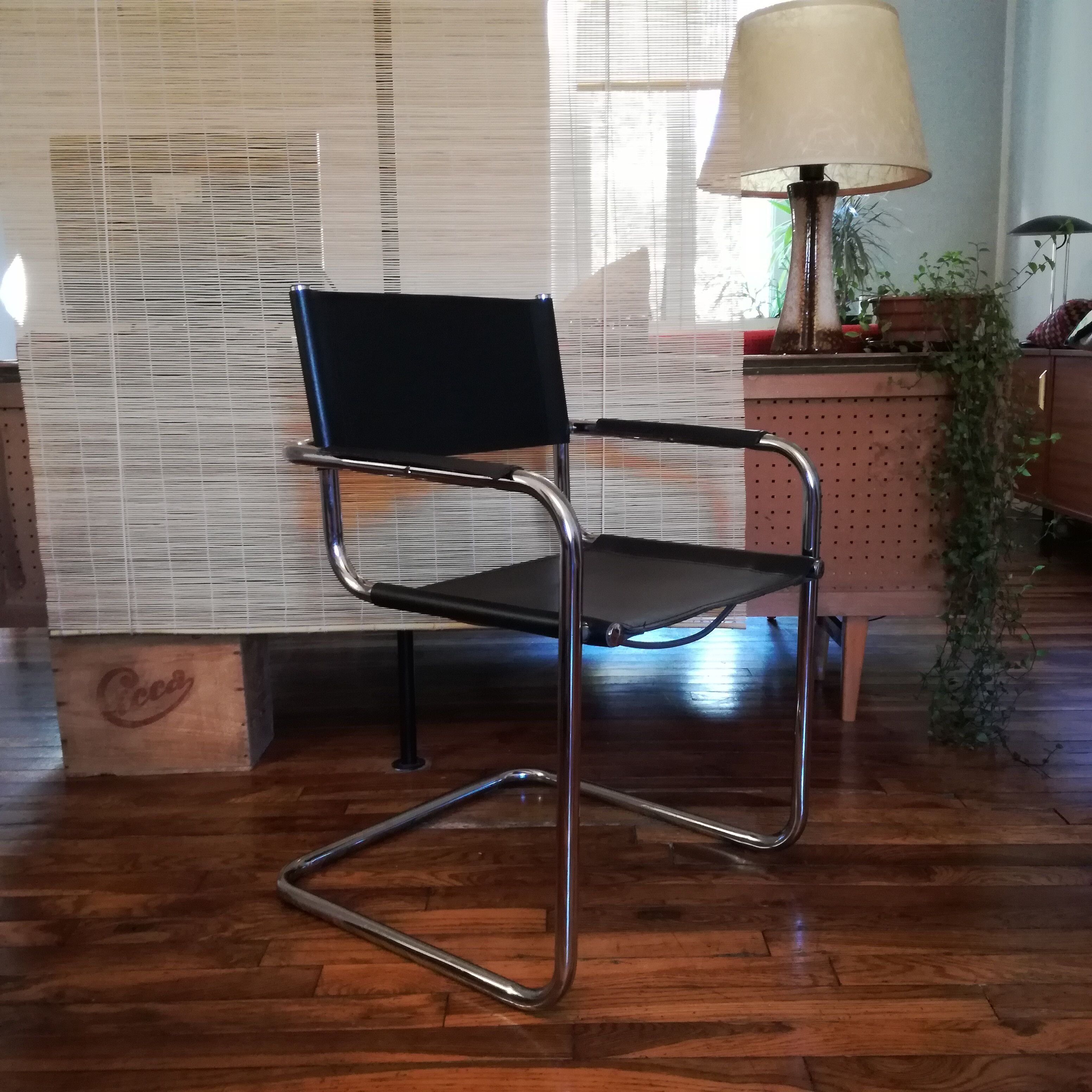 Black leather cantilever armchair