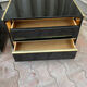 Two lacquered bedside tables.