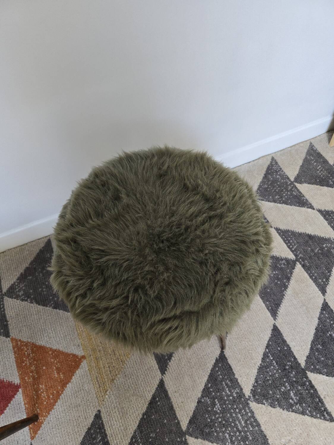 Green wooden tripod stool