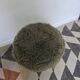 Green wooden tripod stool