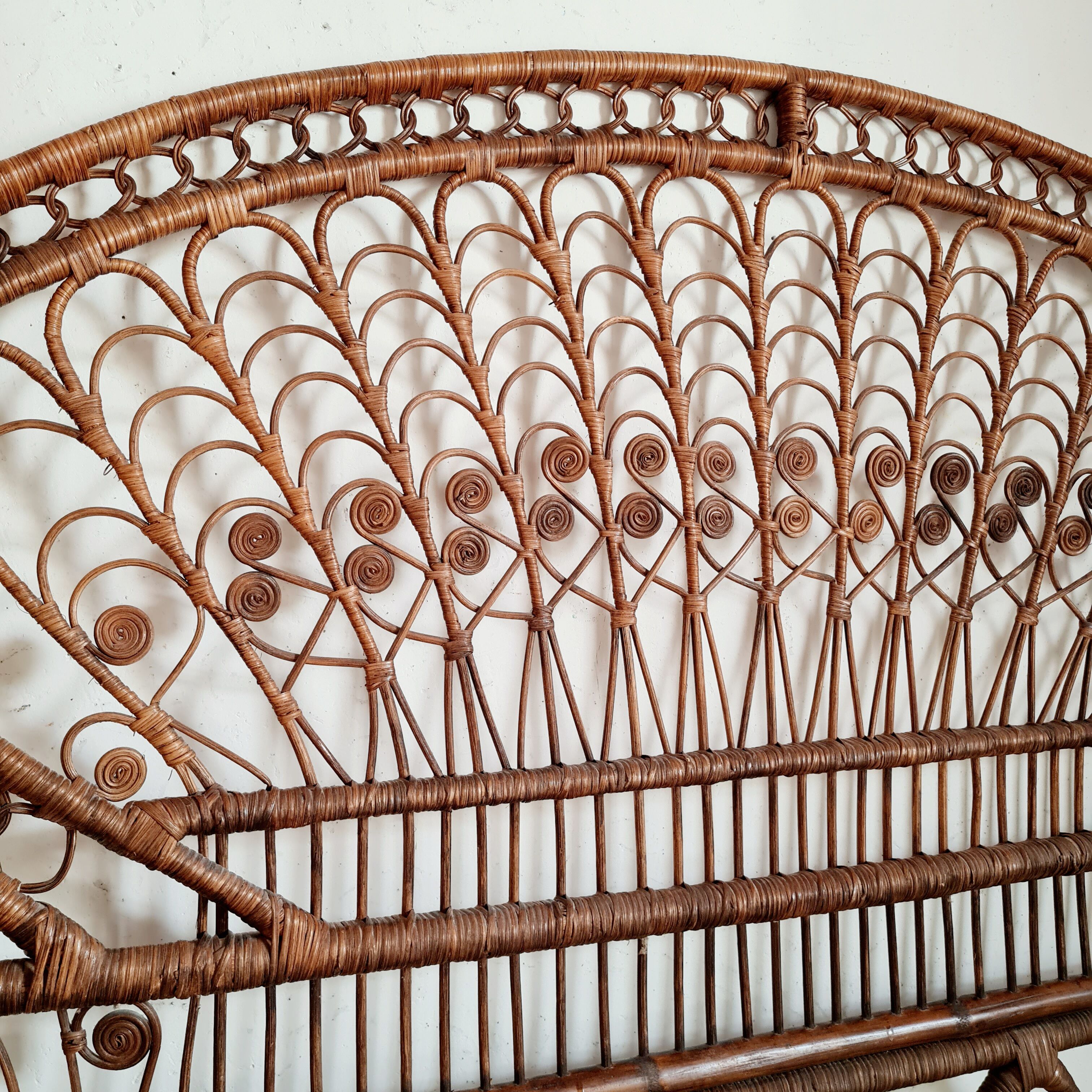 Peacock headboard in vintage rattan