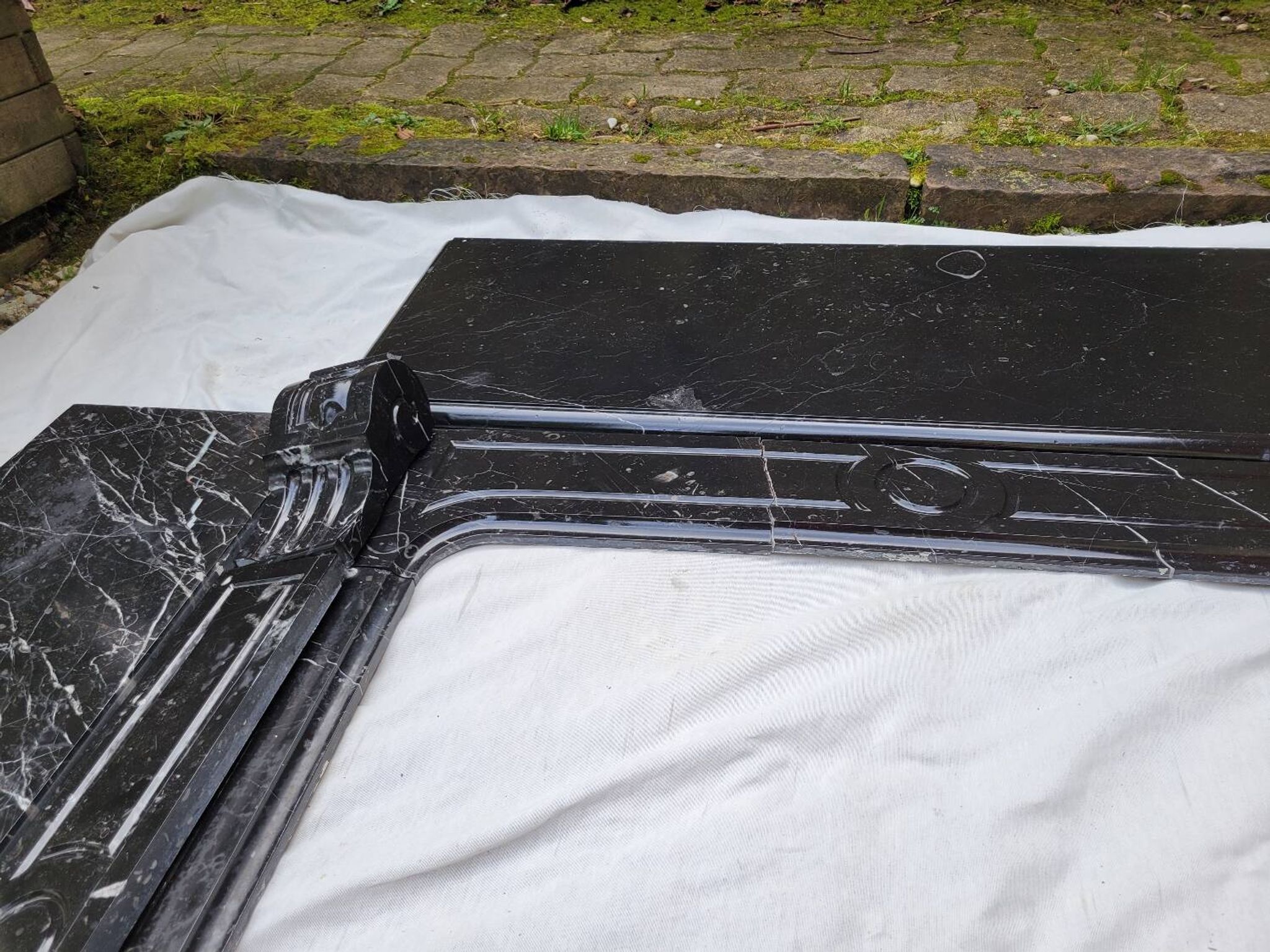 Pompadour fireplace with black marble modillions