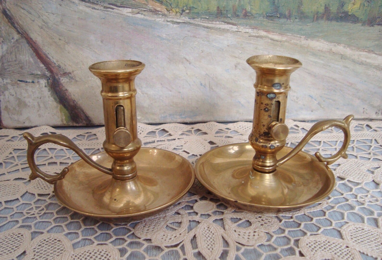 Pair of brass cellar rat candlesticks