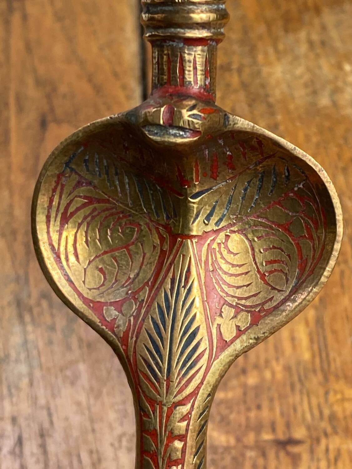 Chiseled brass cobra candlestick