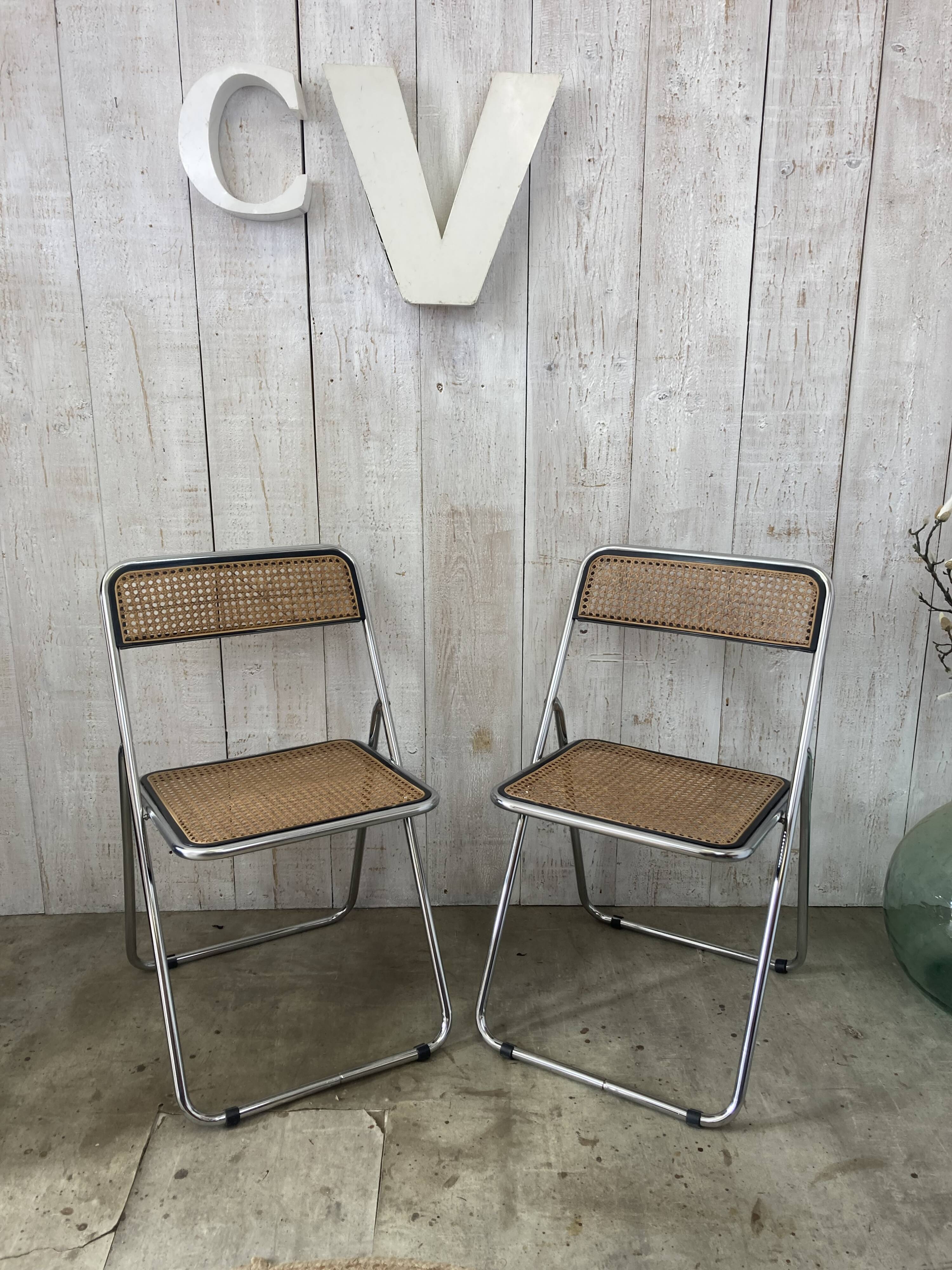 Pair of chrome and cane folding chairs