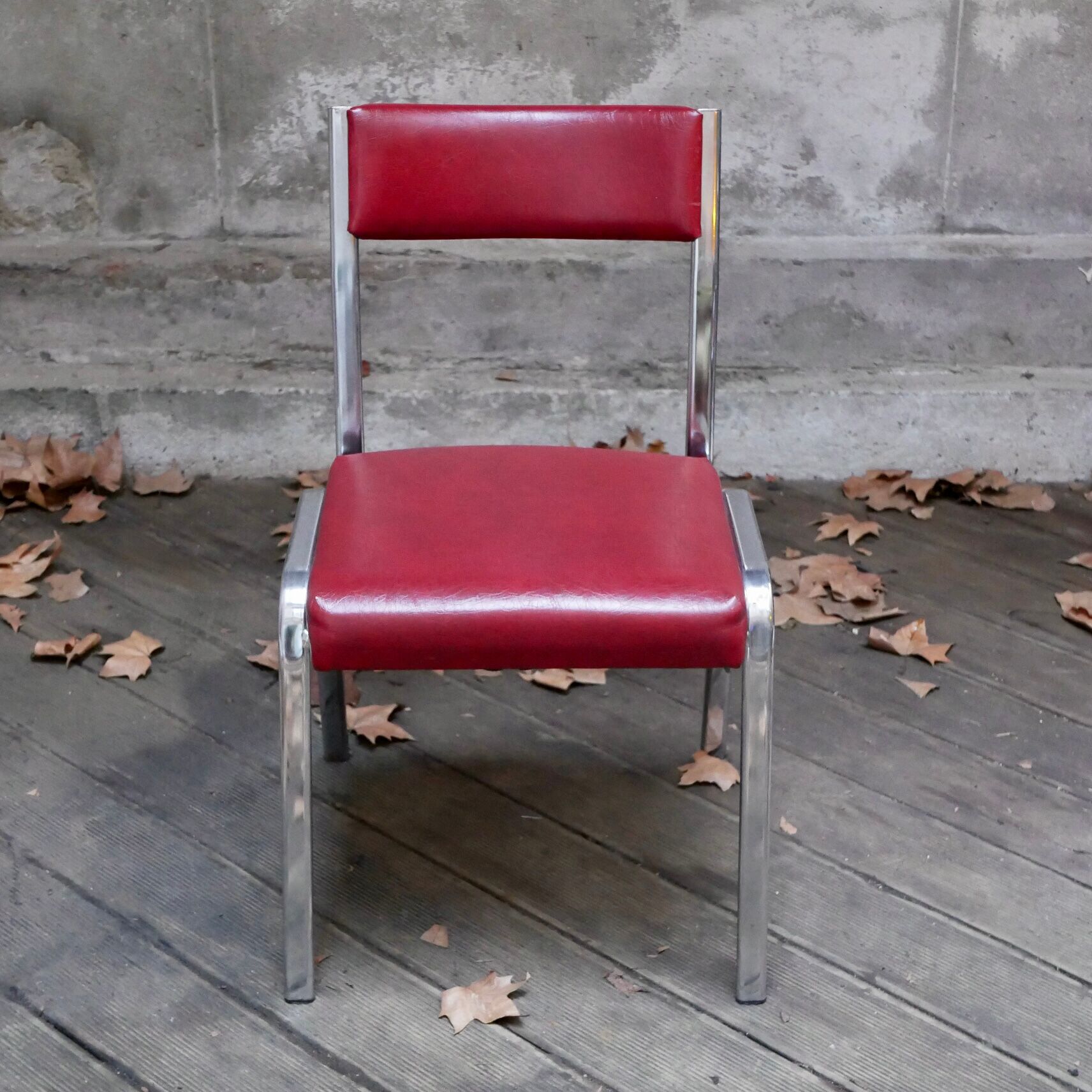 Pair of red leatherette chairs