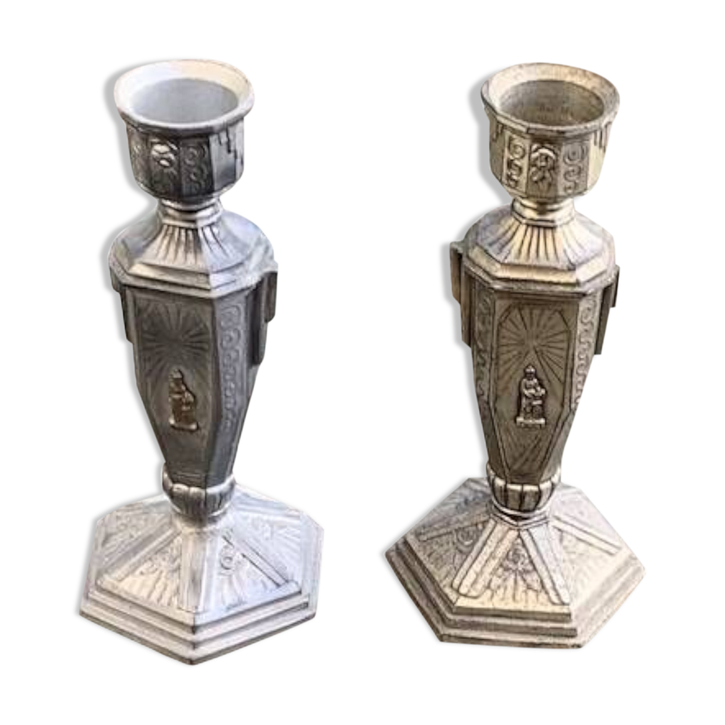 Pair of metal candlesticks, chiseled with a statuette in front, rose pattern in relief, art deco