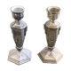 Pair of metal candlesticks, chiseled with a statuette in front, rose pattern in relief, art deco