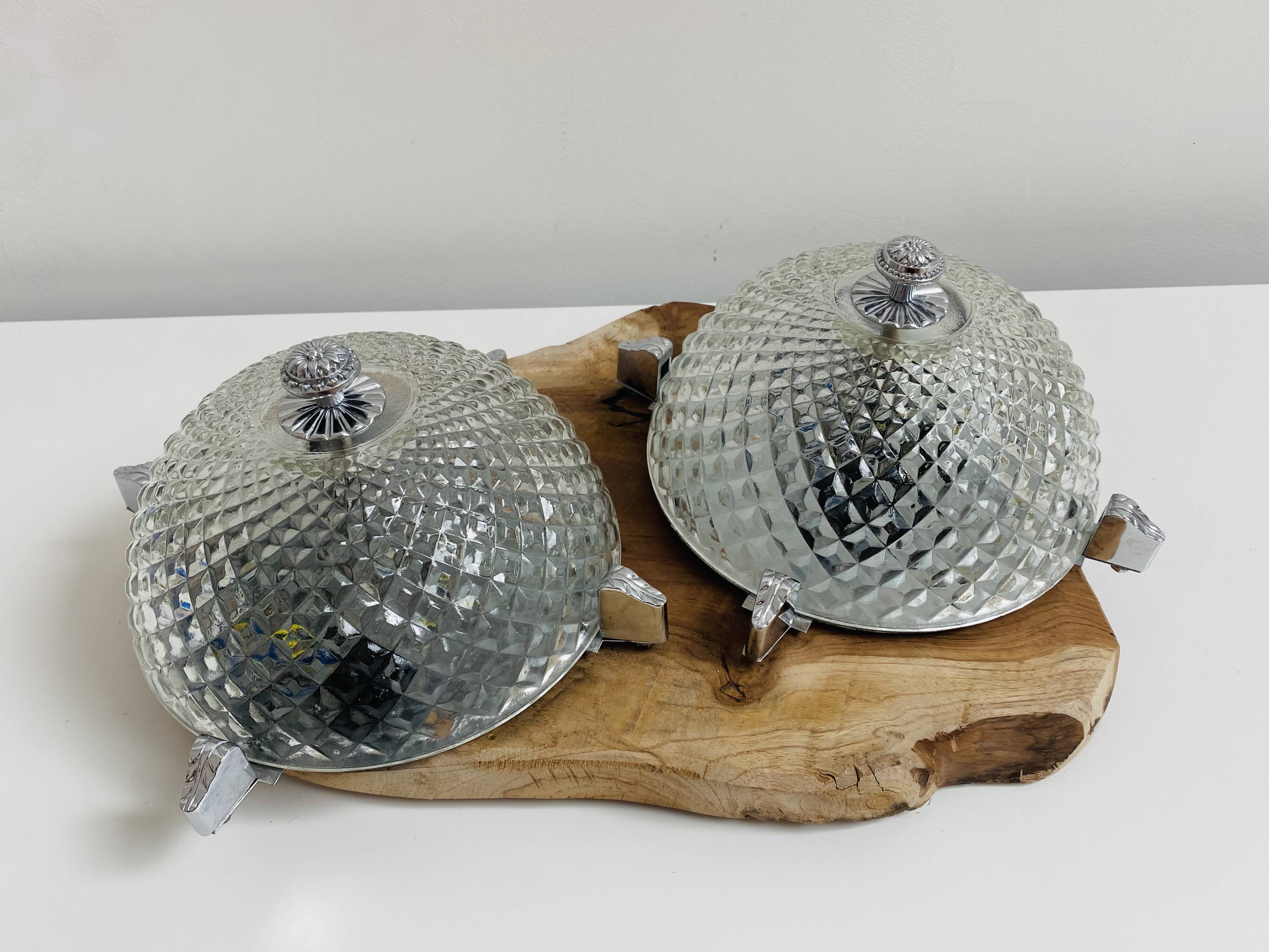 Pair of chrome-plated glass sconces