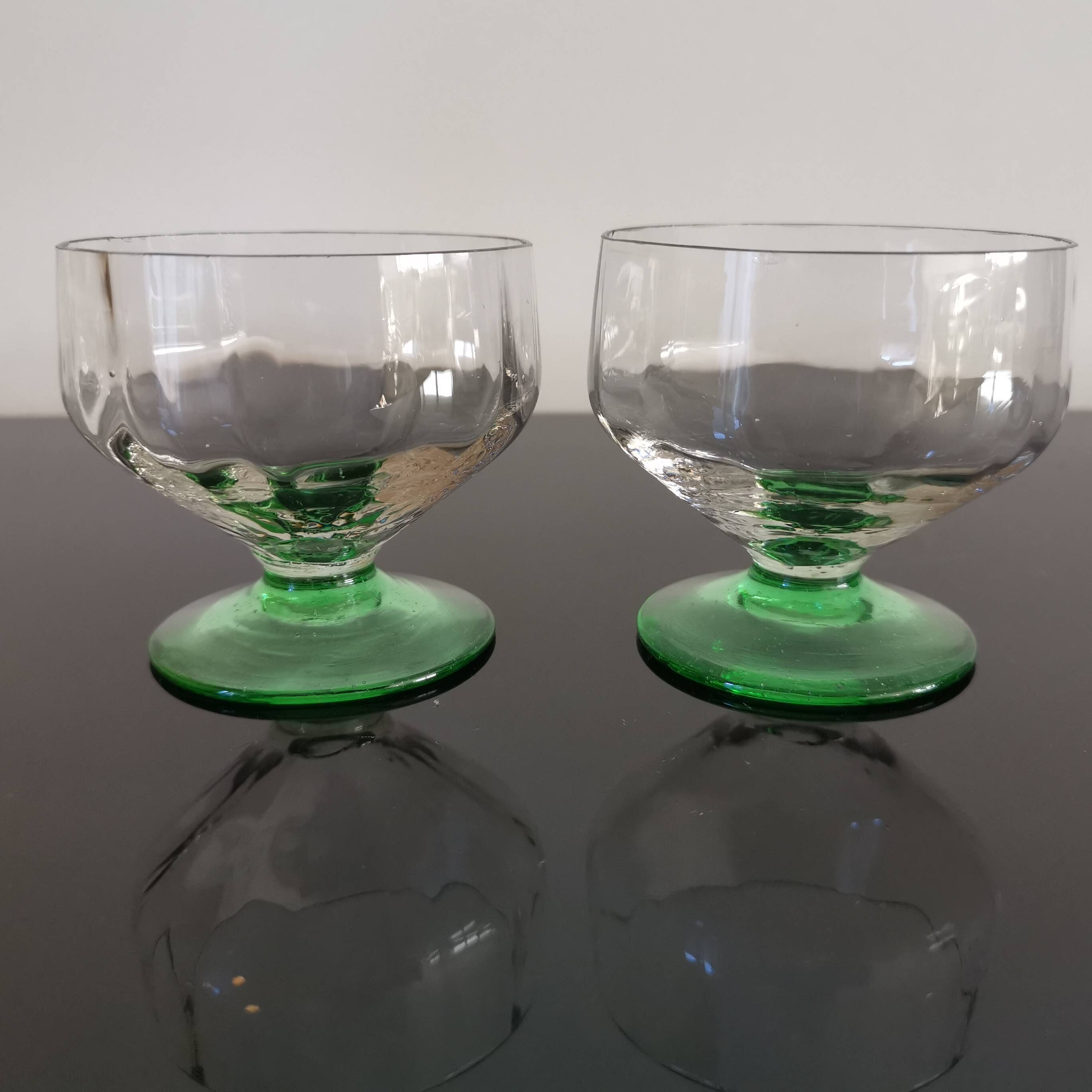2 faceted champagne glasses with green feet, 1930s