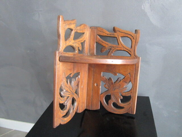 Old corner shelf in worked wood