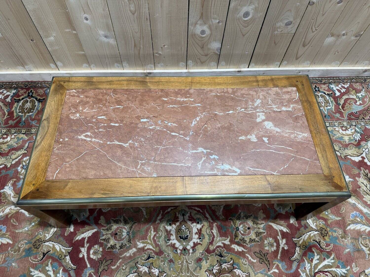 Contemporary coffee table in mahogany and marble.