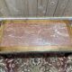 Contemporary coffee table in mahogany and marble.