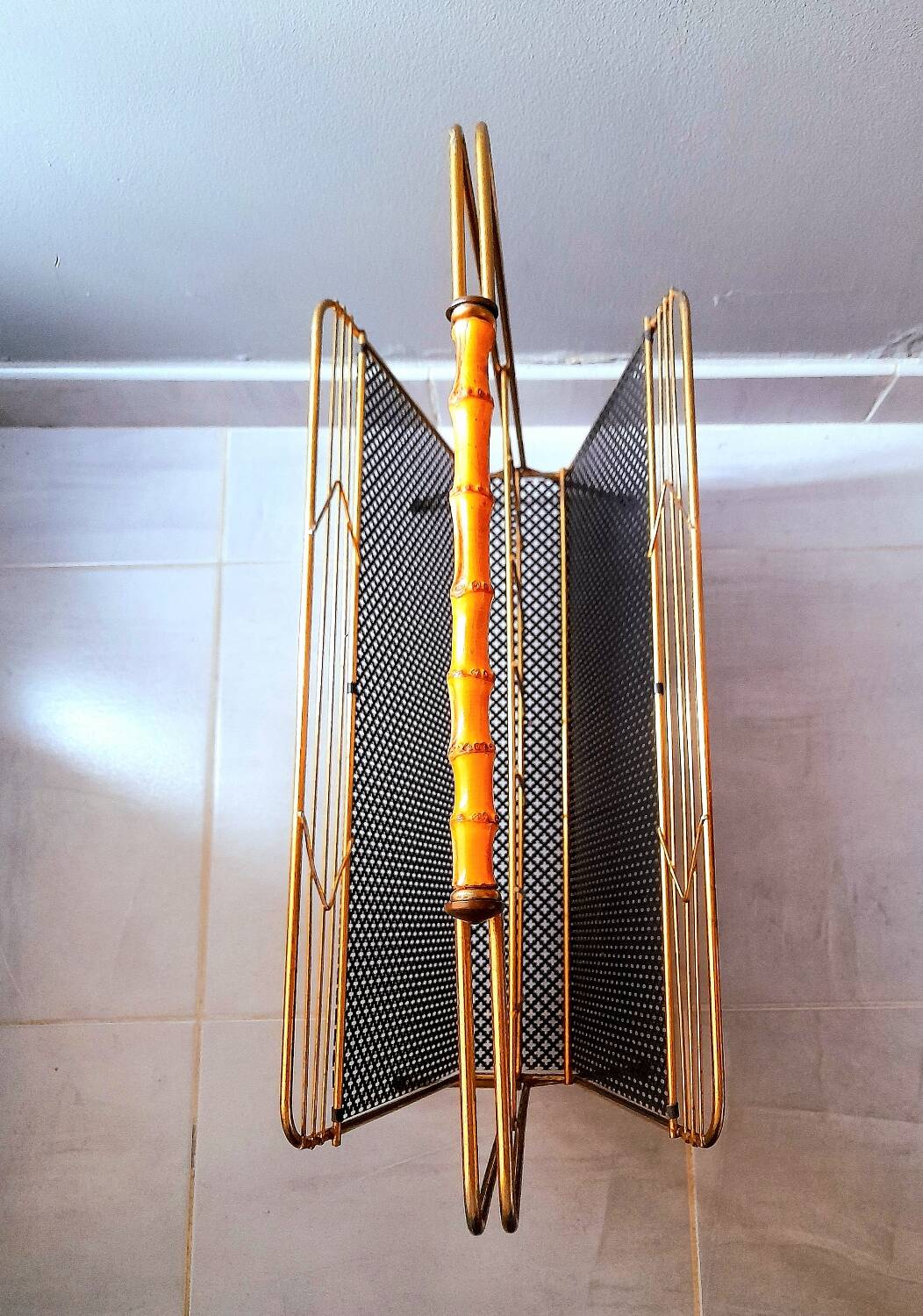 Perforated metal magazine rack 1950