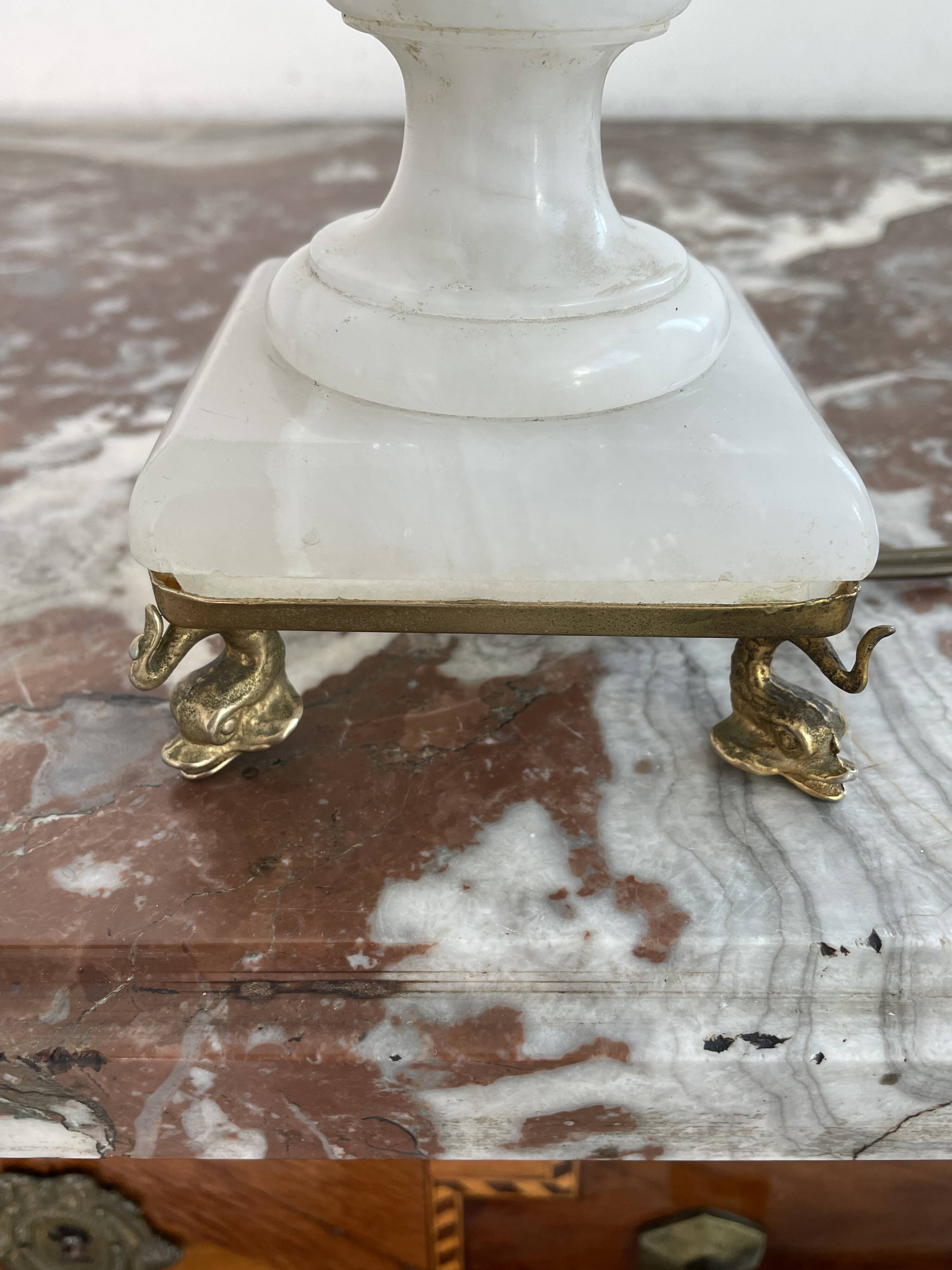 Alabaster lamp, twisted, gadroon decoration, gilded brass base, dolphins
