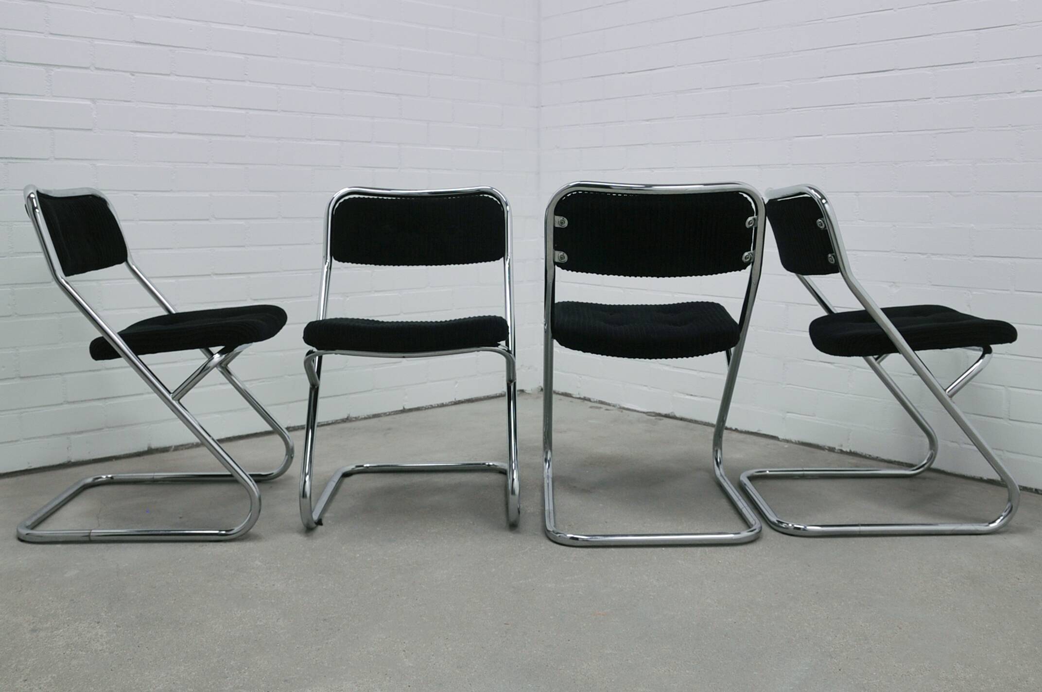 vintage set of x4 chrome tubular chairs black rib