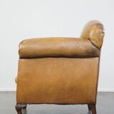 Fauteuil ancien en cuir de mouton