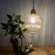 Vintage globe pendant light in bubbled amber glass