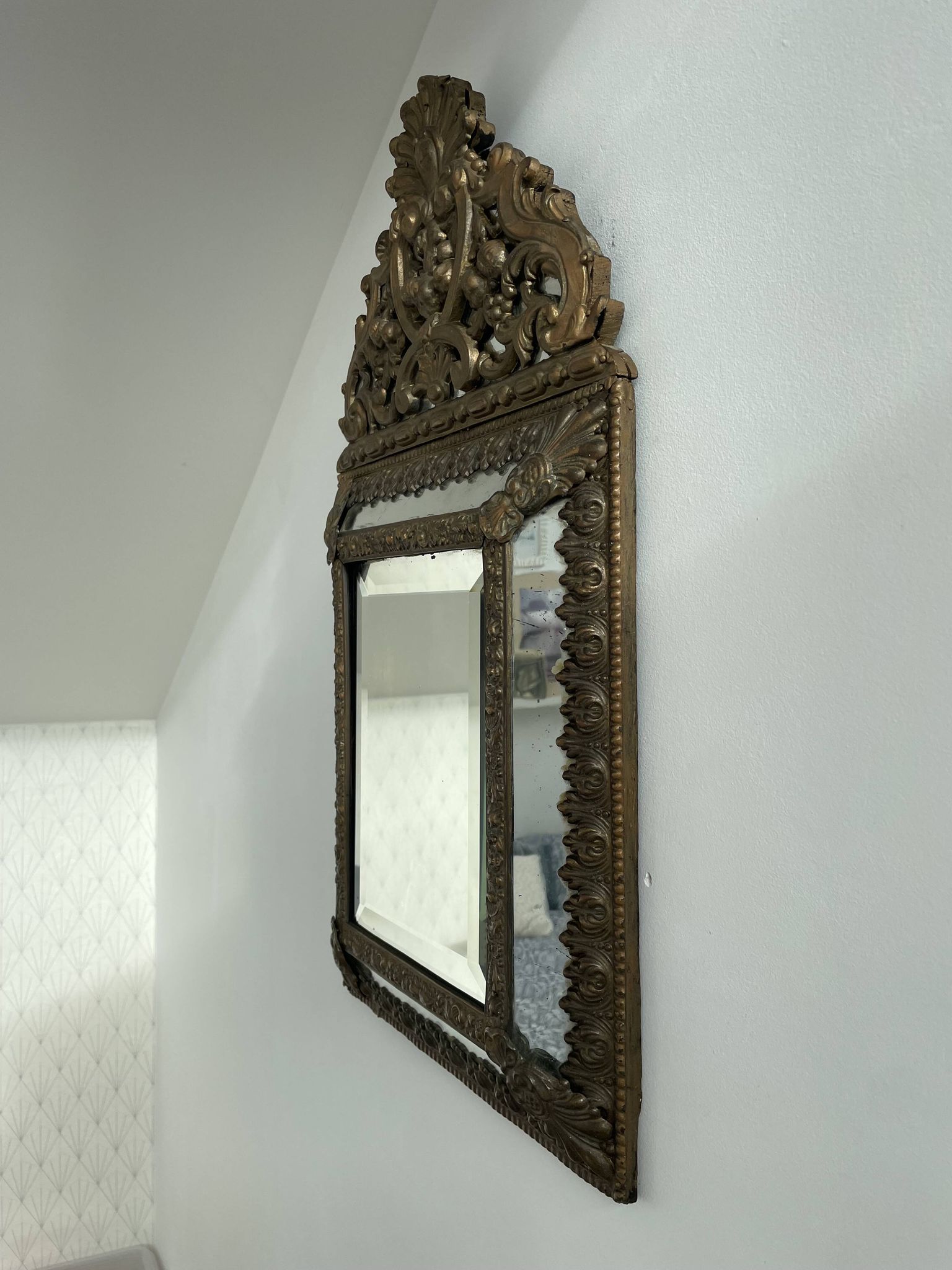Small mirror with brass parcloses in repoussé style Louis XIV, late 19th century.