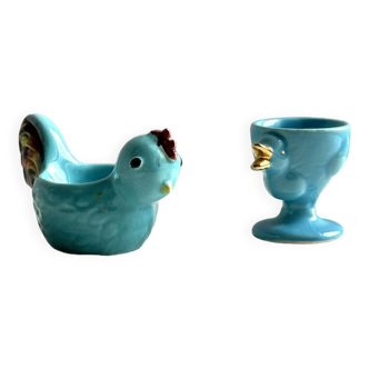 2 blue ceramic egg cups, rooster and chick.