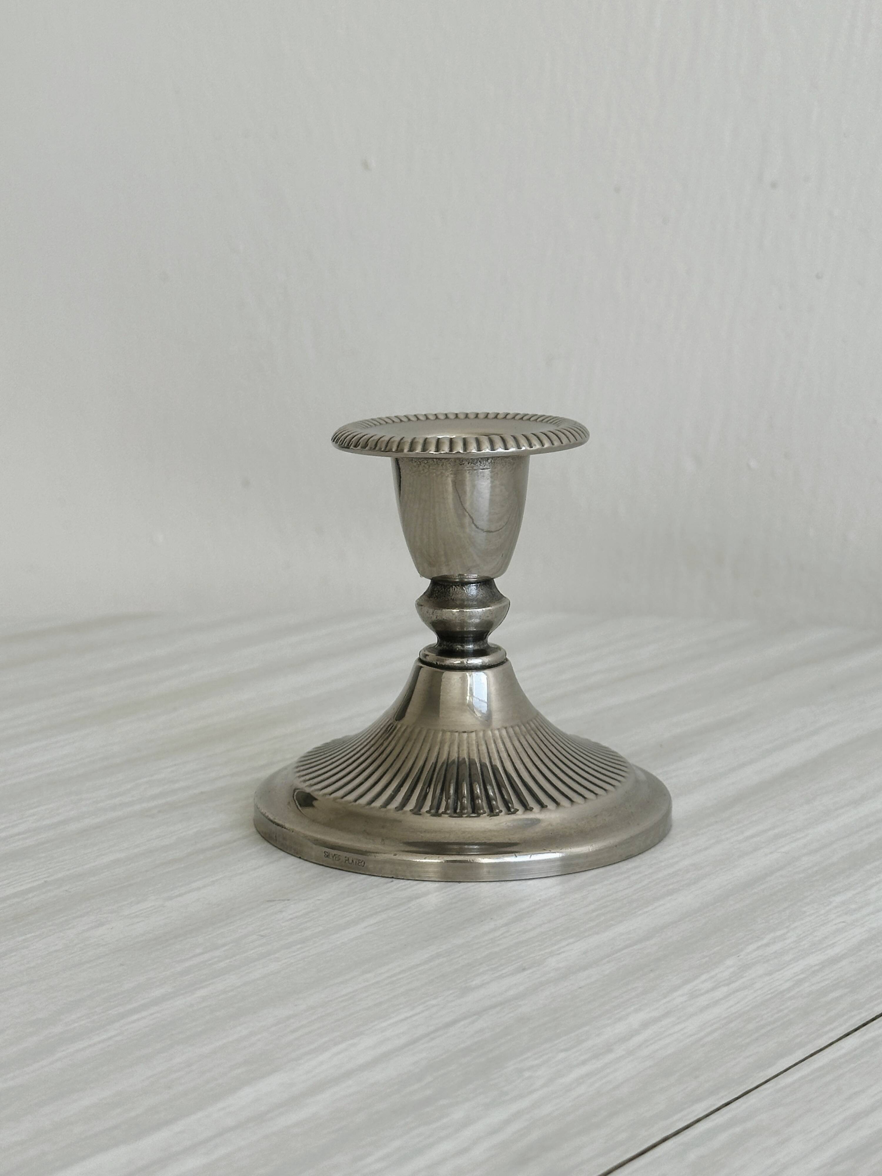 Antique patinated metal candle holder
