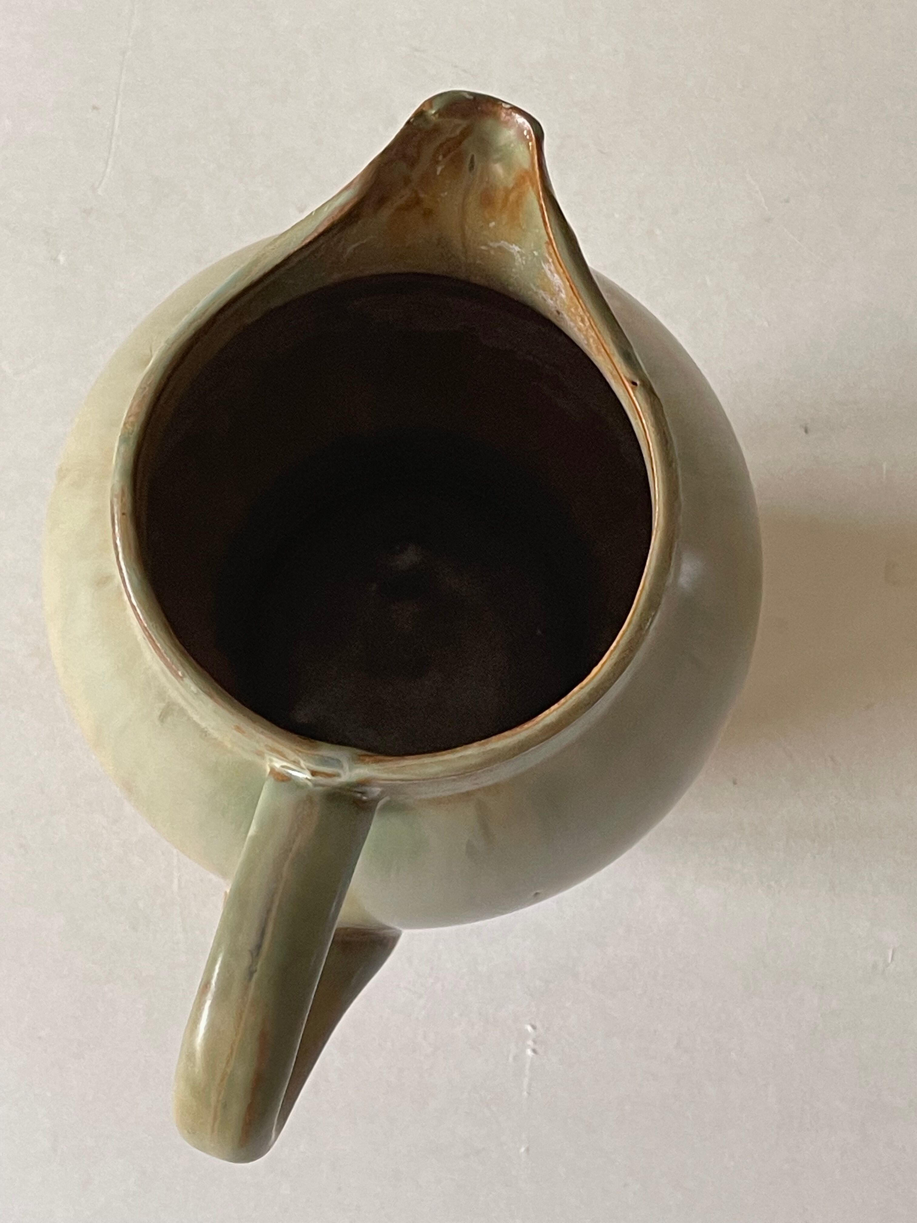 Pitcher in art deco sandstone